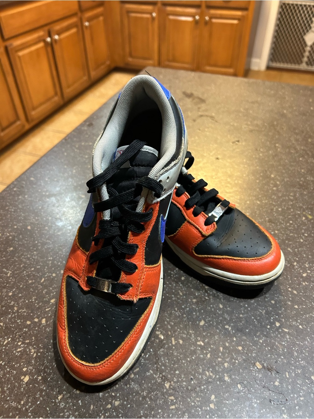 Nike Men's Black and Orange Low-Top Sneakers with Blue Accents